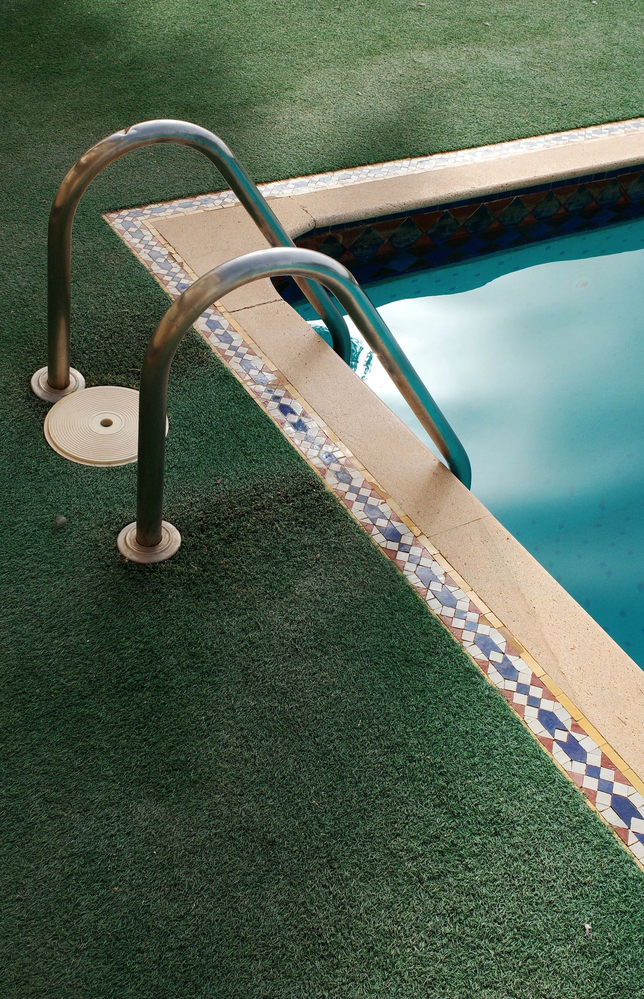 Artificial turf poolside installation