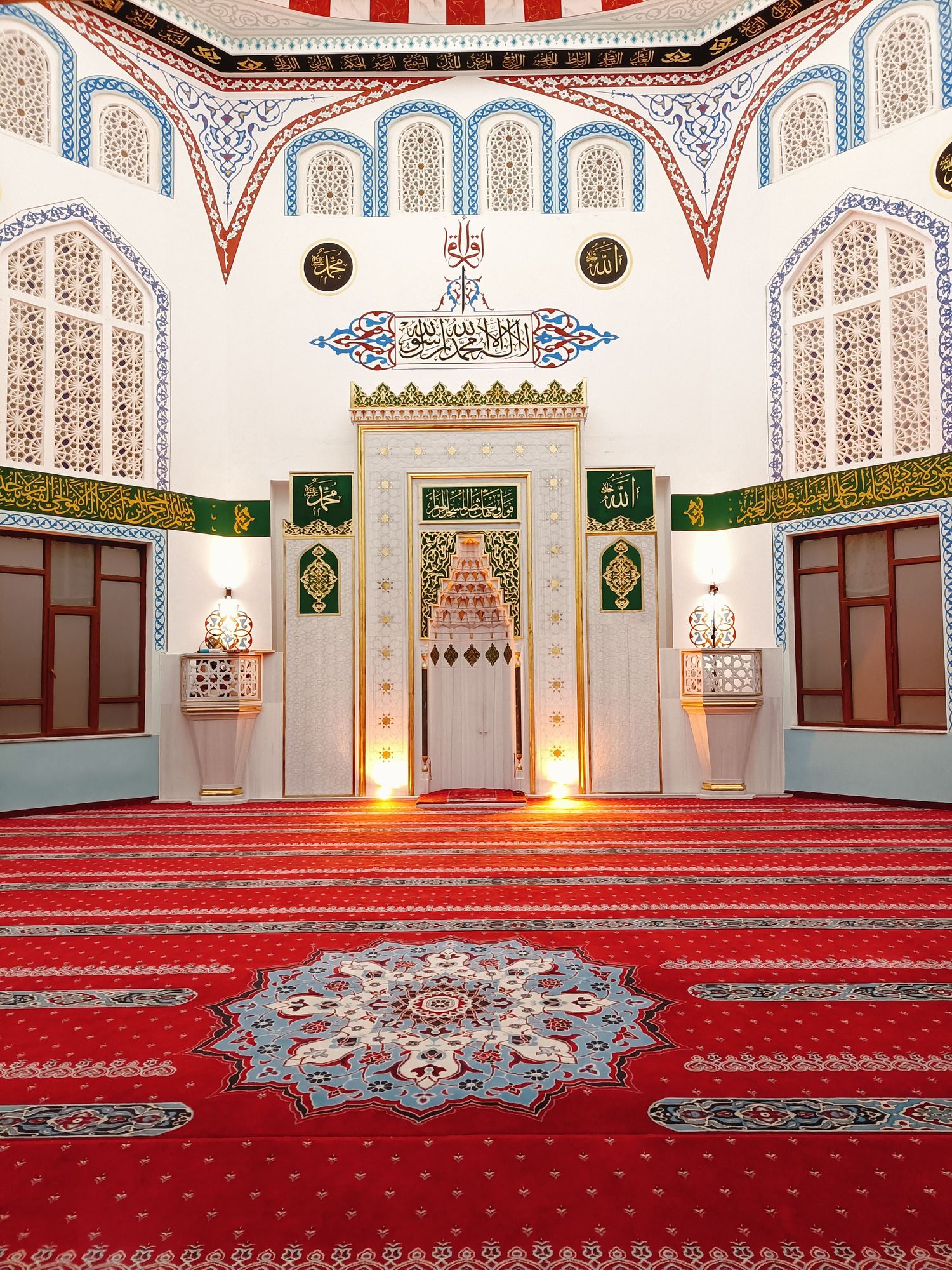 Mosque mihrab wall with medallion carpet