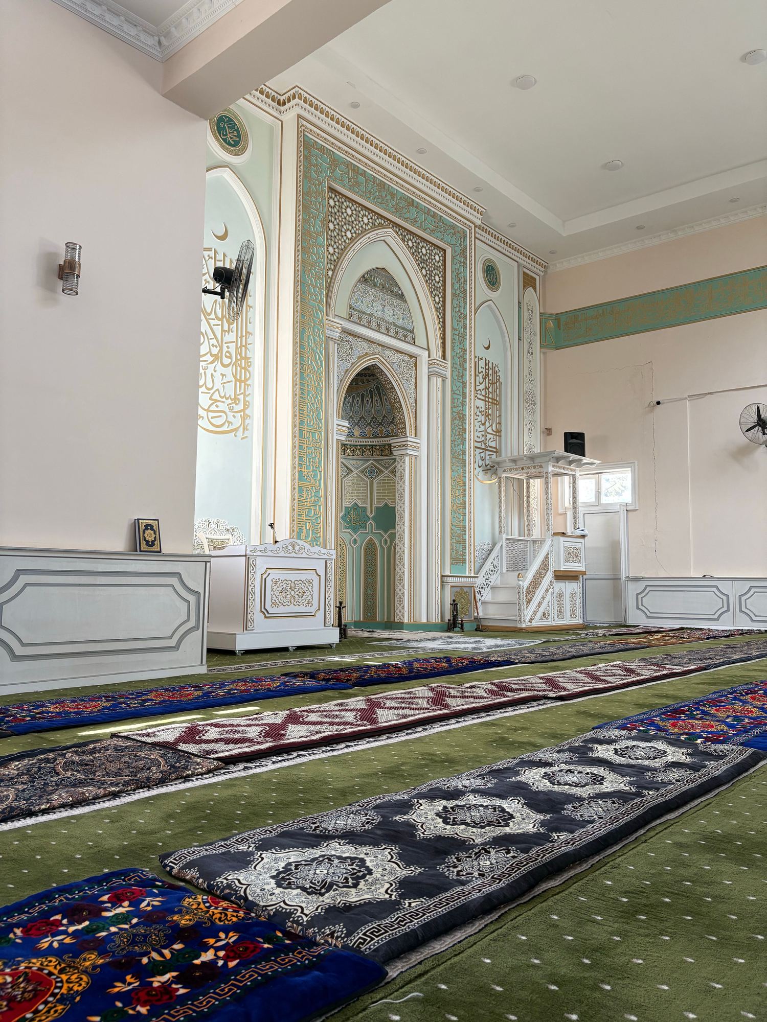 Row of individual prayer mats